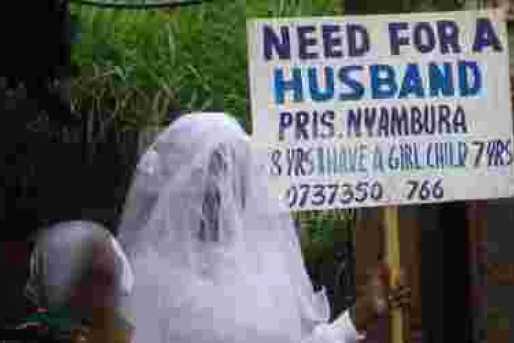 Placard-Carrying Nairobi Woman in Search of Husband Re-Unites with Father after 22 Years