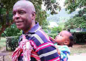 Photo of Makueni Governor Prof Kivutha Kibwana Carrying Child on His Back Goes Viral Online 