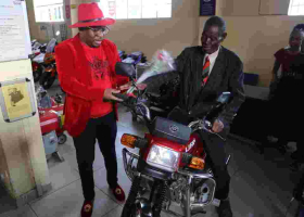 76-Year-Old Man Who Cycled 223Km to Attend Moi's Burial Receives Motorbike, Posho Mill from Sonko