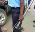 Kenyan Policeman Pictured Handling Murder Weapons with Bare Hands, Kenyans React