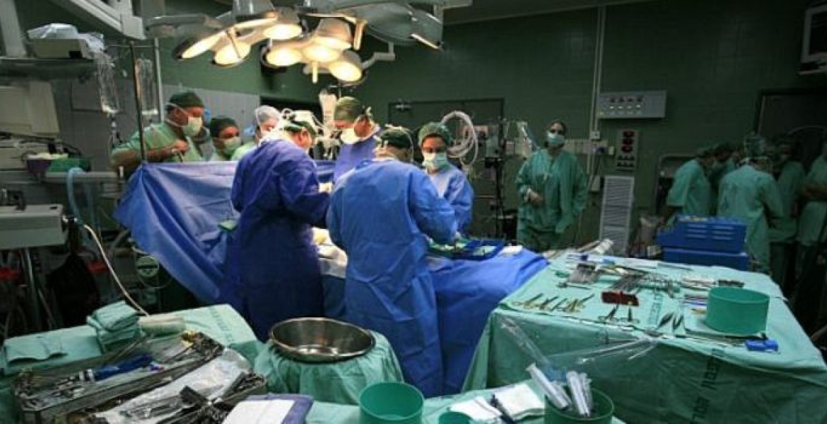 Doctors and Nurses Inside an Operating Room Kenya Introduces Social Health Fund for Overseas Treatment, with Stringent Guidelines