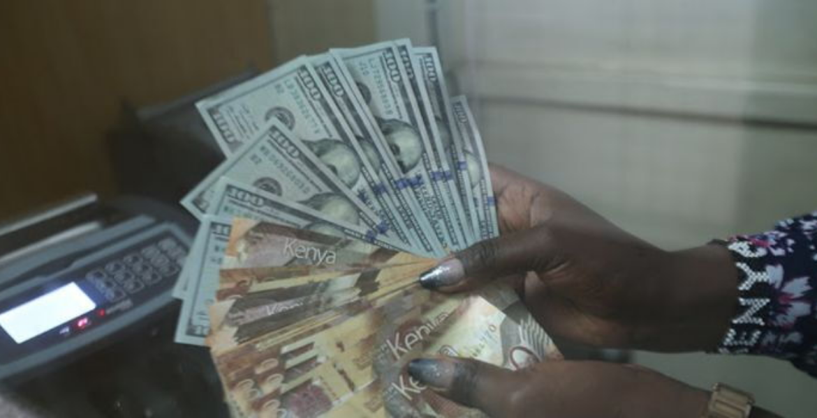 An Employee at a Forex Bureau Holding a Thousand Kenyan Notes and a Hundred Dollar Bills Kenyans in the Diaspora Step Up Financial Support for Families Back Home