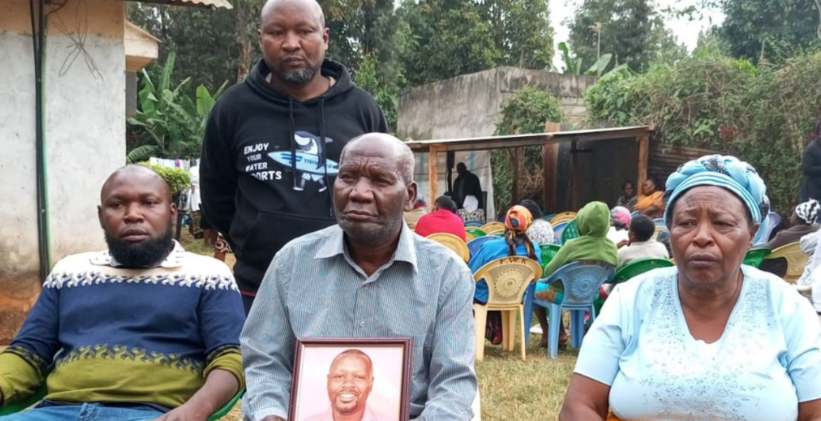 John Thiong'o, Kariuki's Father Displays his Photo Accompanied by his Mother Esther Wambui Kenyan Family Seeks Government Help Over Son’s Detention in UAE