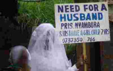 Placard-Carrying Nairobi Woman in Search of Husband Re-Unites with Father after 22 Years