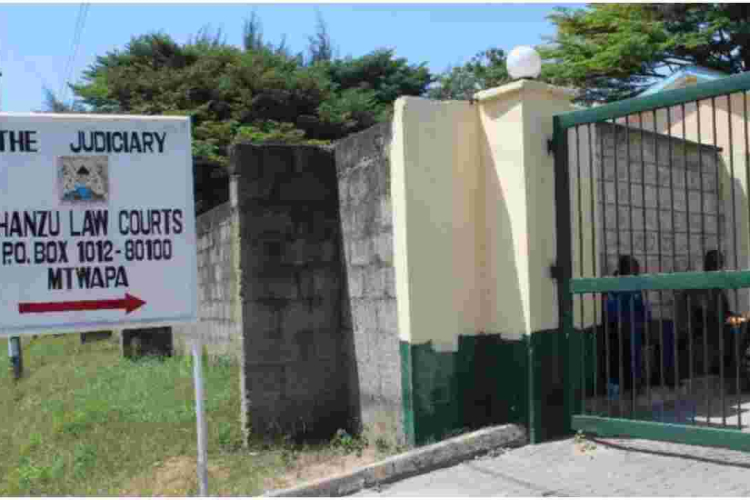 Woman Caught on CCTV Sprinkling White Powder Outside Magistrate's Office in Mombasa 